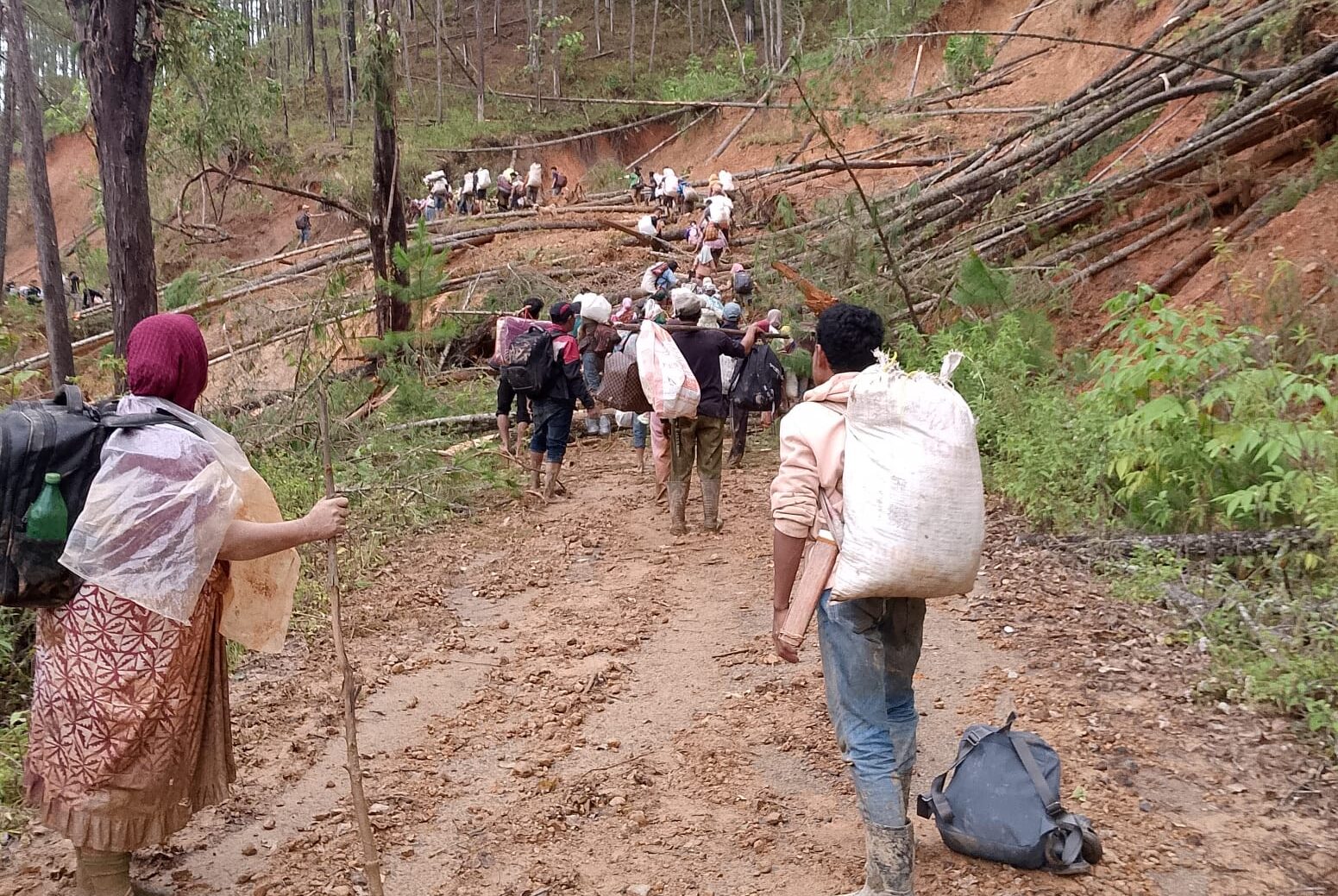 Local people walk to find supplies